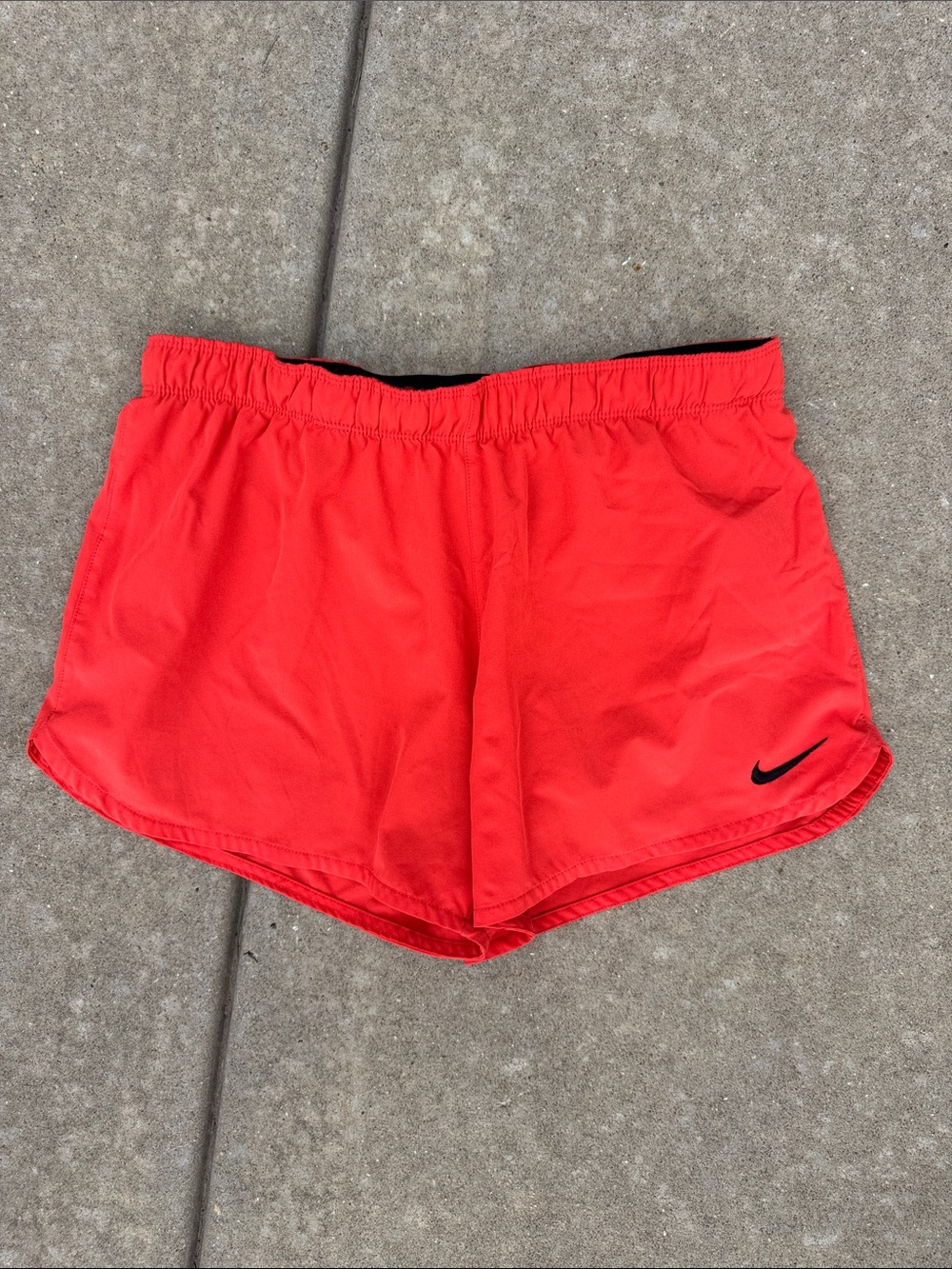 Nike Coral-Red Athletic Running Shorts with Black Swoosh